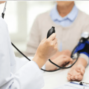 A doctor checking blood pressure of a person